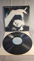 Black vinyl LP record of Marianne Faithfull's 'Broken English' with original cover sleeve showing wear and album art.