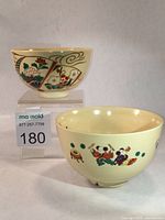 Two Kyoto Ware matcha bowls side by side showing overall size and decoration.