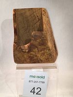 Open maple burl wood box with visible natural wormholes and grain on one side.