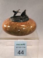 Front angled view highlighting the wood grain and pewter hummingbird detail on top of the box.