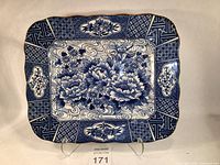 Full view of rectangular Arita style platter showing detailed blue floral and geometric transfer patterns on white ironstone.
