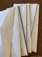 Seven envelopes labeled with years containing Canadian uncirculated coin sets from 1972, 1973, 1974, 1977, and 1978.
