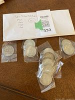 Envelope with handwritten list of coin years and quantity