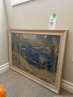 Angle view of the framed Spring Ice print showing artwork and beige wooden frame.