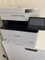 Front view of Canon Color imageCLASS MF642Cdw showing touchscreen and output tray