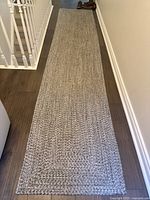 Full view of carpet runner laid out in hallway