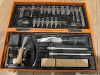 Full view of open orange case showing all components