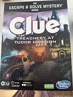 Front of sealed Clue Treachery at Tudor Mansion game box
