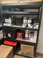 Front view of full shelving unit loaded with various household items (contents not included)