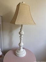 Full view of one lamp showing base and shade