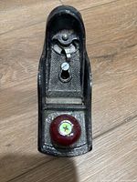 Top view showing lever cap, adjustment mechanism, red knob