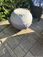 Fire pit covered with protective cover