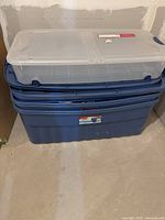 Stacked blue totes with clear tote on top