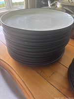 Stack of dinner plates shows quantity and design