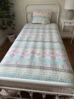 Full view of twin bedspread on bed with matching sham