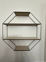 Front view showing full hexagonal shelf with three tiers