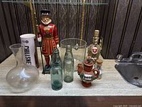 Full set of 11 pieces on display, showing diversity of shapes and materials