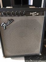 Front view of Fender Sidekick 30 Bass Amplifier showing control panel and grille.