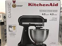 Front of boxed KitchenAid Classic tilt-head stand mixer showing brand, model, capacity and tilt-head design