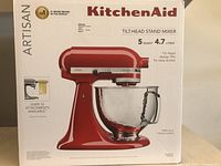 Front of box showing KitchenAid Artisan Tilt-Head Stand Mixer image and branding
