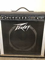 Front view of Peavey Special 112 amplifier showing control panel and speaker grill with brand logo.
