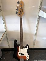 Full length front view showing sunburst body and neck with Peavey logo on headstock