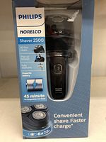 Front of box showing the Philips Norelco Shaver 2500 with features like 4D Flex Heads, pop-up trimmer, washable design, 45 minute battery life, and faster charge.