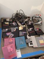 Overall lot on table showing cartridges, controllers, cables and headgear