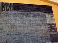 Overall view of rug showing pattern and colors