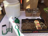 Overall view: dehydrator, jars, lids, tools