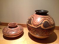 Both ceramic pots side by side on surface