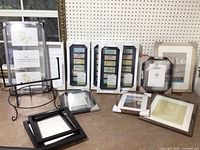 Group shot of all frames and metal easel