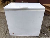 Front view of white Frigidaire chest freezer, lid closed