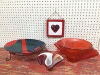 Four fused glass pieces: round bowl on stand, two wavy bowls, hanging heart panel