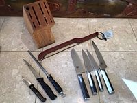 Full group showing knife block, bread cutter, honing steel, paring knife, boning knife and four Shun knives