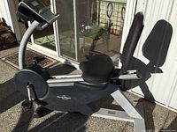 Side view of NordicTrack recumbent bike with seat, backrest and console visible