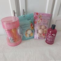 Lot with Calgon Take Me Away Bath Set, Quo and Bodycology bath fizzies, and I Love Raspberries & Blackberries bubble bath