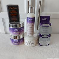 Images show full lot including Mane Choice curl defining creams, leave-in conditioner, edge control jars, Shea Moisture black soap sealed bar, and coconut oil jar.