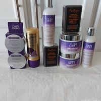 Photo of all products in the lot arranged on white surface: 2 jars of The Mane Choice Curl Defining Cream, 2 bottles of The Mane Choice Bond Repair Leave-in Conditioner, 2 sealed packs of The Mane Choice 48H Edge Control, 2 boxes of Shea Moisture African Black Soap, and 1 bottle of Pantene Gold Series Detangler.