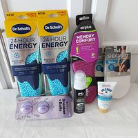 Full lot arranged with all items visible including 2 Dr. Scholl's insoles, Airplus insoles, 2 packs of Secret socks, Gold Bond ointment, Mb Brillo shoe polish, and Sneaker Balls deodorizer.