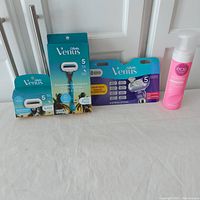 Full lot showing all items including Gillette Venus razors and eos shave cream