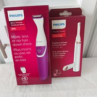 Philips Series 2000 Bikini Trimmer and Philips Precision Trimmer in original boxes showing front packaging details