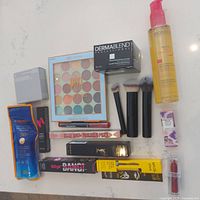 Photo of makeup and skincare lot with Pixi palette, mascara, bronzer, and more