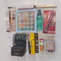 Overview of all makeup products included in the lot, all new and boxed or sealed.