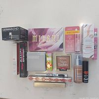 Full lot top view showing all 15 makeup items with packaging and boxes