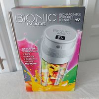 Front of the sealed box showing blender image and usage examples