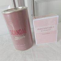 Photo of the Jean Paul Gaultier Scandal canister and the Givenchy Irresistible box showing the packaging appearance.