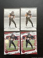 Four football trading cards laid out: two Prestige 2024 Drake London rookie cards and two Absolute Football 2024 Drake London rookie cards, all Atlanta Falcons themed.