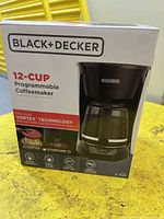 Front of sealed box showing product image and key features