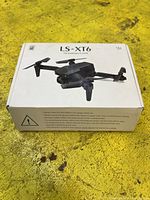 Box labeled LS-XT6 showing image of the drone